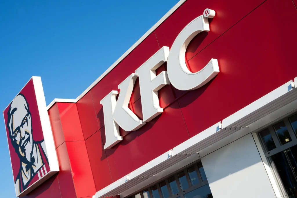 Exterior of a KFC restaurant showing the KFC logo Why KFC Isn't Called Kentucky Fried Chicken Anymore
